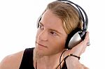 Young Male Busy With Headphones Stock Photo