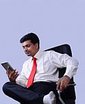 Young Male Executive Using Digital Tablet Stock Photo