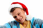 Young Male Wearing Christmas Hat Stock Photo