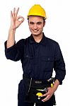 Young Male Worker Giving The Ok Sign Stock Photo