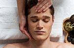 Young Man Getting Spa Treatment Stock Photo