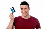 Young Man Holding Credit Card Stock Photo