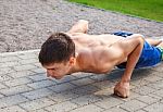 Young Man Practicing Of Push-up Stock Photo
