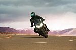 Young Man Riding Big Motorcycle On Asphalt Highway ,use For People Leisure Traveling And Adventure Lifestyle Stock Photo