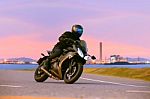 Young Man Riding Sport Touring Motorcycle On Asphalt Highways Ag Stock Photo