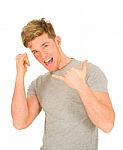 Young Man Showing Calling Gesture Stock Photo