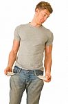 Young Man Showing Empty Pockets Stock Photo