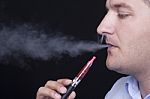 Young Man Smoking E-cigarette Stock Photo