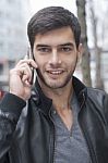 Young Man Talking With Cell Phone Stock Photo