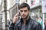 Young Man Talking With Cell Phone Stock Photo