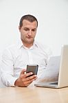 Young Man Using Tablet And Mobile Phone Stock Photo