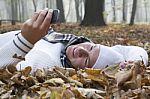 Young Man With Smile And Mobil Phone In Autumun Stock Photo