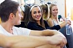 Young People Resting After Class In The Gym Stock Photo