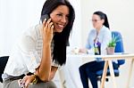 Young Pretty Business Woman With Mobile Phone In Her Office Stock Photo