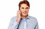 Young Professional Talking On Mobile Stock Photo