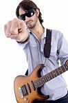 Young Rock Star Posing With Guitar Stock Photo