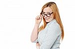 Young Woman Adjusting Her Eyeglasses Stock Photo