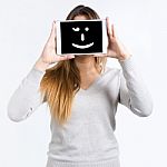 Young Woman Cover Her Face With Digital Tablet. Isolated On Whit Stock Photo