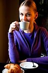 Young Woman Drinking Coffee Stock Photo