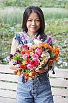 Young Woman Holding Bouquet Of Flower Stock Photo