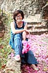 Young Woman Holding Paper Flower In Hand Stock Photo