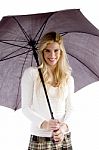 Young Woman Holding Umbrella Stock Photo