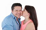 Young Woman Kissing Her Boyfriend Stock Photo