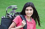 Young Woman On A Golf Course Stock Photo