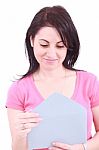 Young Woman Opening A Letter Stock Photo