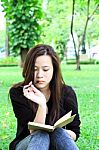 Young Woman Reading Stock Photo