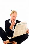 Young Woman Reading Newspaper Stock Photo