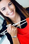 Young Woman Shopping For Clothes Stock Photo