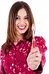 Young Woman Showing Toothbrush Stock Photo