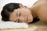 Young Woman Sleeping On Mat Stock Photo