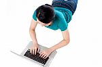 Young Woman Using Her Laptop, Top View Stock Photo