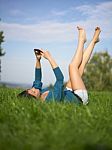 Young Woman Using Laptop In Park Stock Photo