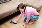 Young Woman Washing Wooden Floor With Blue Floorcloth Stock Photo