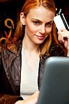 Young Woman With Credit Card And Laptop Stock Photo