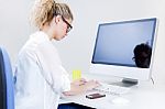 Young Woman Working From Home On The Computer Stock Photo